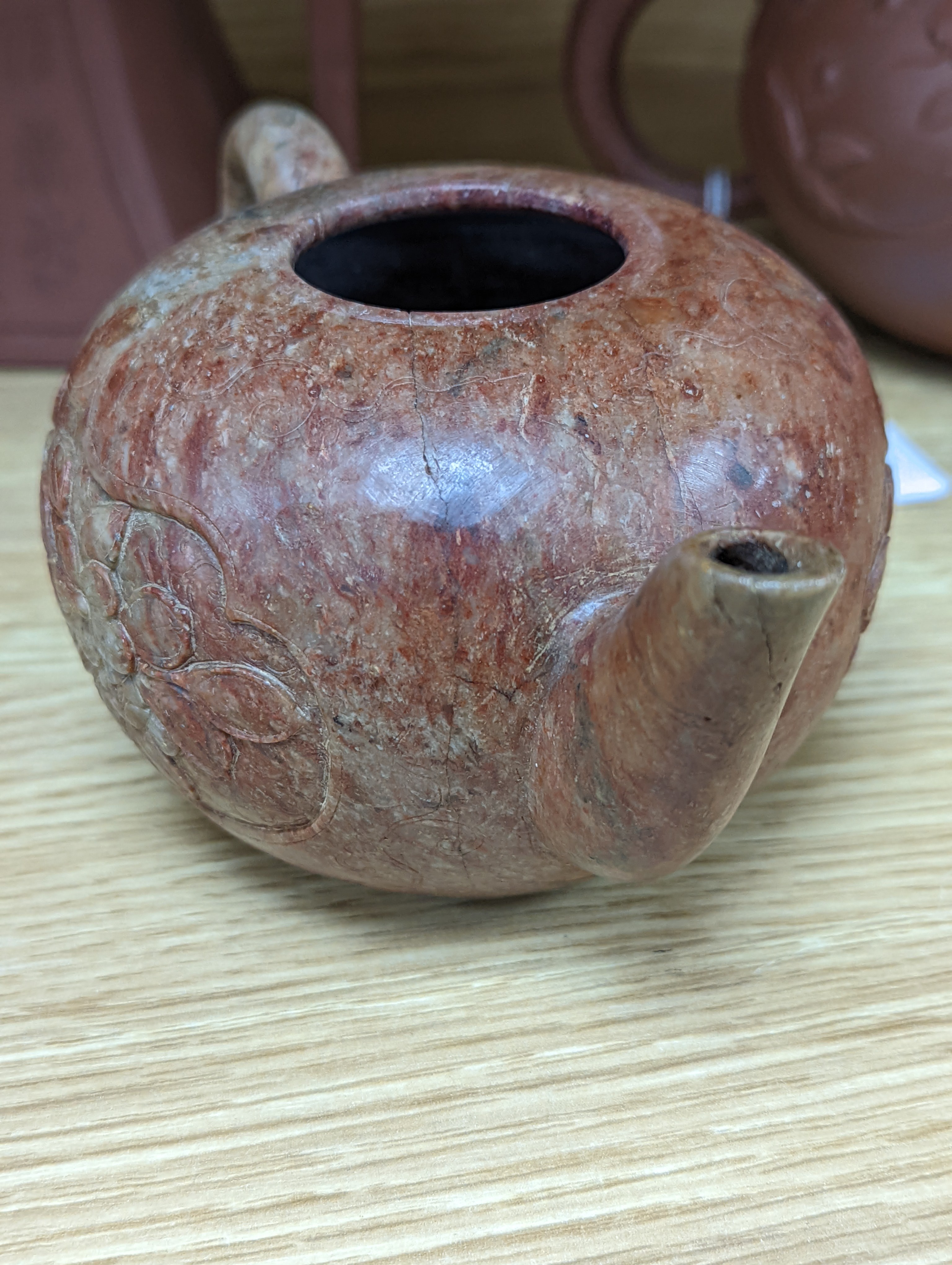 Three Chinese Yixing teapots and a carved soapstone teapot tallest 12cm